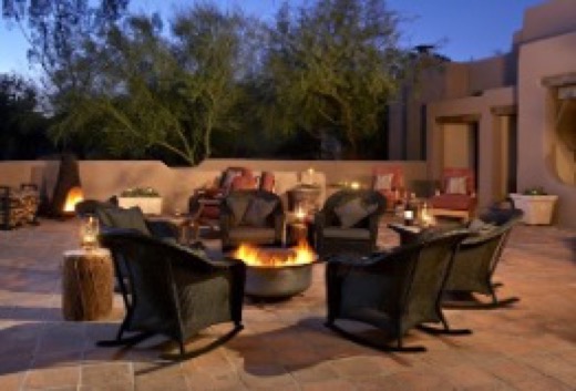 Outdoor fire-pit lounge in the evening